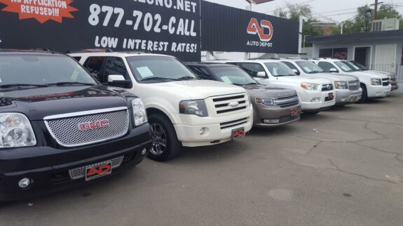a row of cars in a parking lot