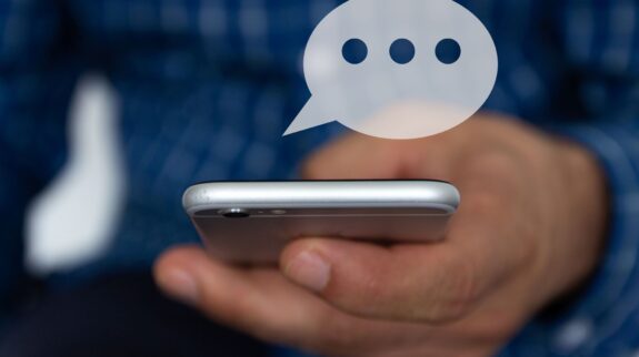 automotive_text_messages a person holding a cell phone
