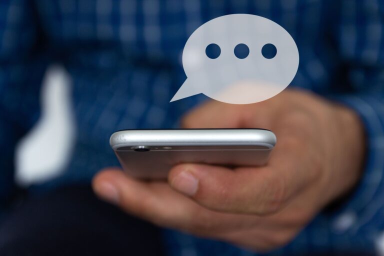 A Person Holding A Cell Phone