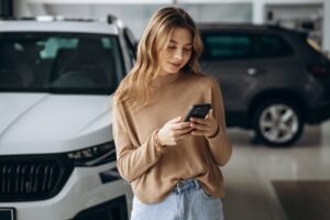 a woman holding a phone
