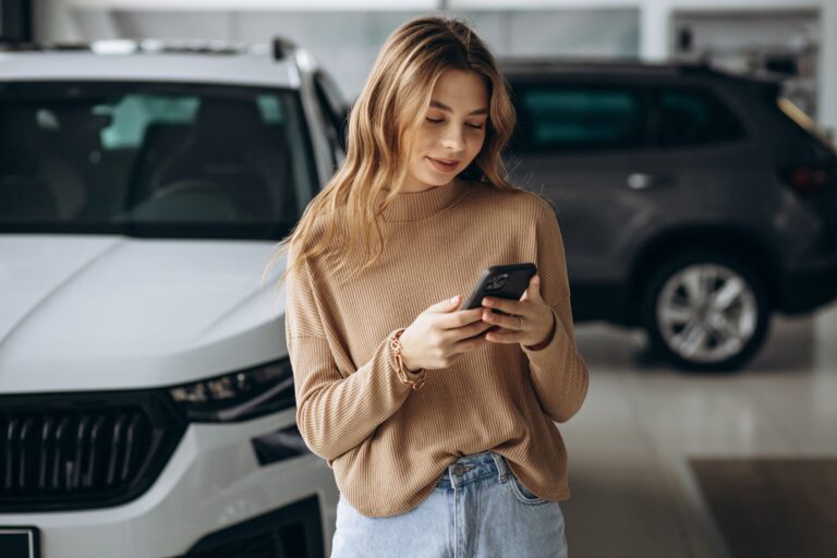 Why A Text Message First Strategy Is A Game-Changer: A Case Study From Our Chevrolet Dealership 1 A Woman Holding A Phone