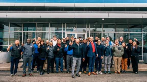 jason_girdner_tecobi_josh_potts_mac_haik_chevrolet_2 a group of people posing for a photo