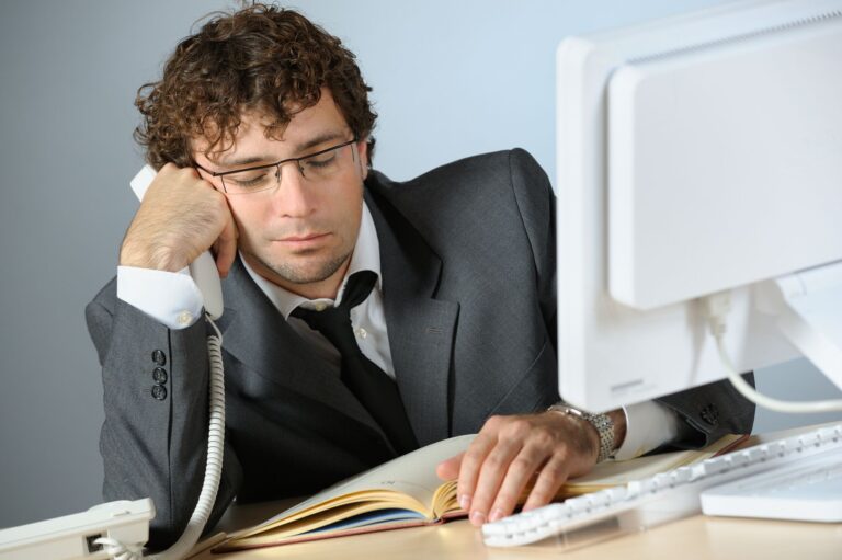 A Man In A Suit And Tie On The Phone