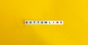 a white square tiles with black and red letters on a yellow background
