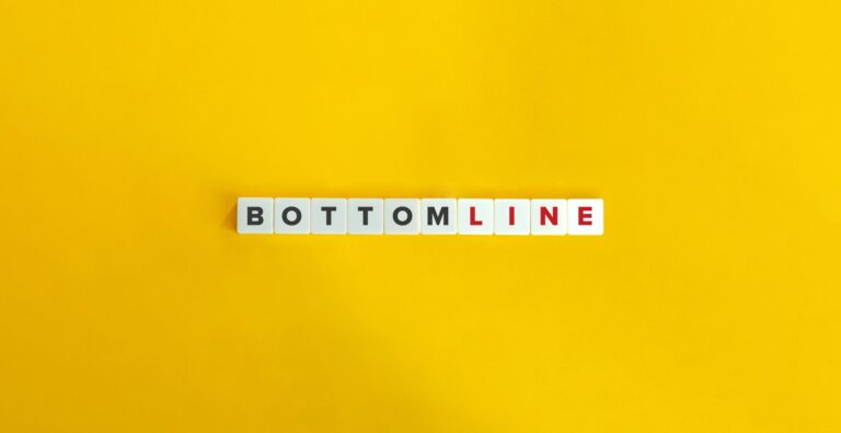 A White Square Tiles With Black And Red Letters On A Yellow Background