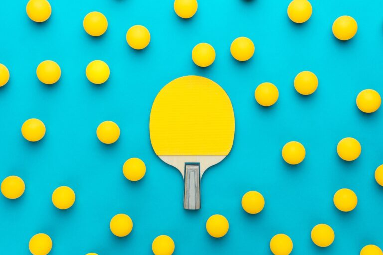 Tecobi Sales Engagement: Simplifying Car Sales With The Ping-Pong Effect 1 A Paddle And Balls On A Blue Surface