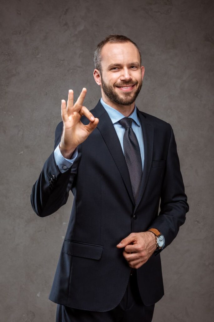 Businessman In Suit Showing Ok Sign