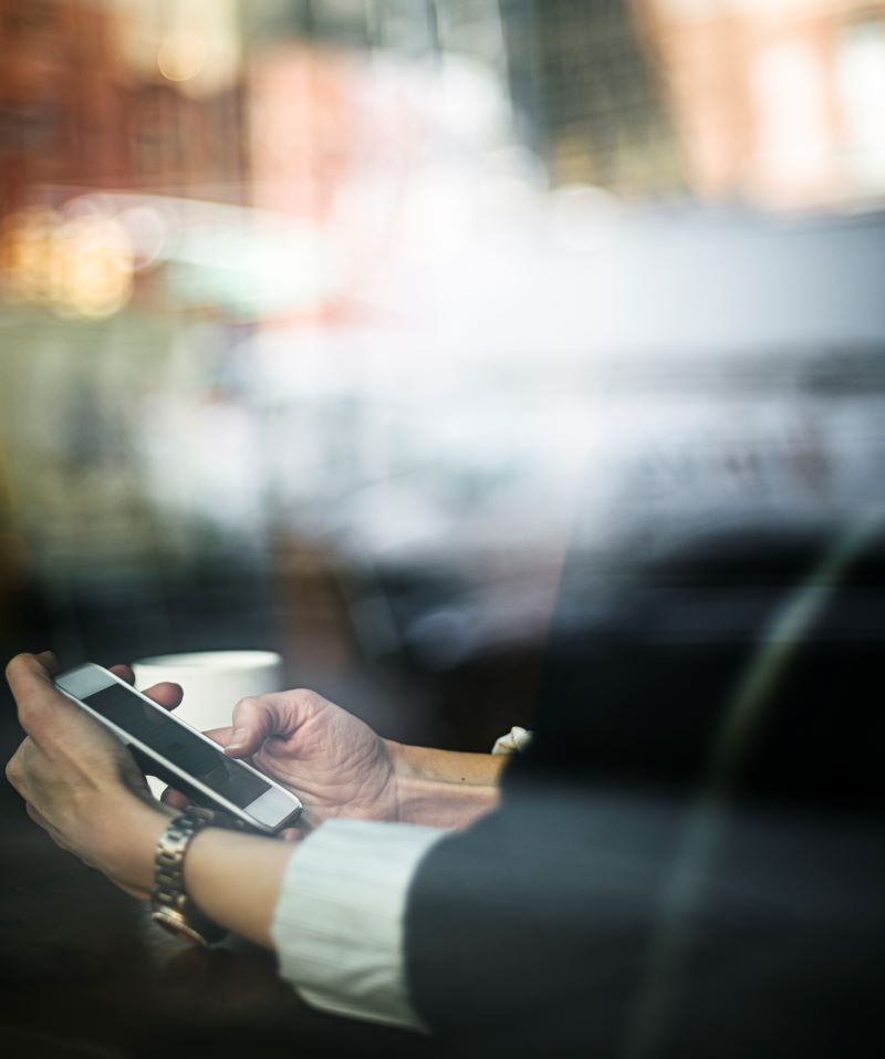 Sms Marketing 101: What Every Automotive Dealer Needs To Know 1 Businesswoman Reading A Message