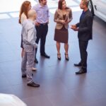 car dealer meeting with clients