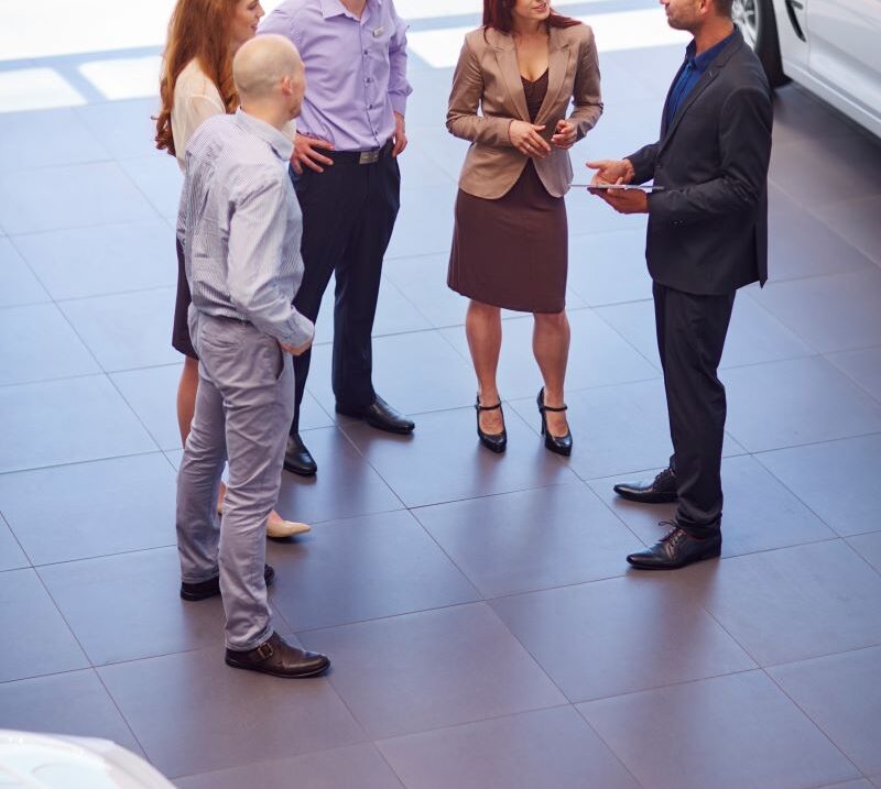 car dealer meeting with clients