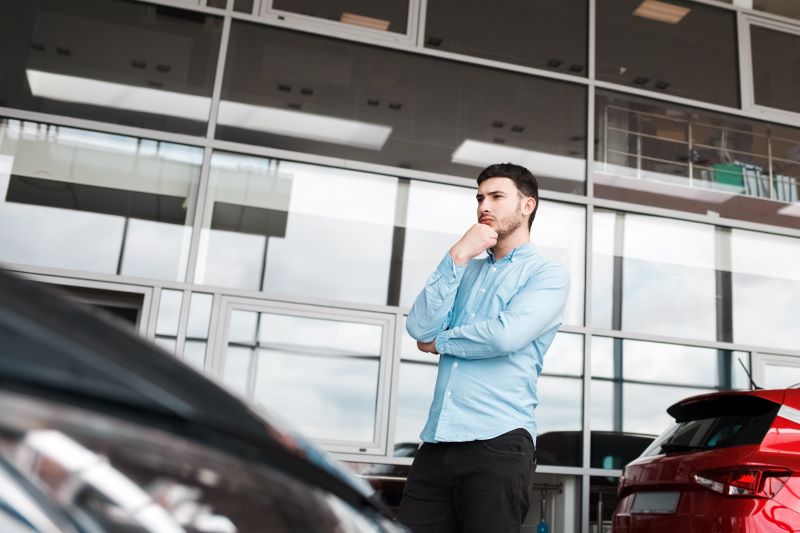 Lead Overload? Here'S How To Manage And Prioritize For Maximum Roi 4 Man Looks At Cars