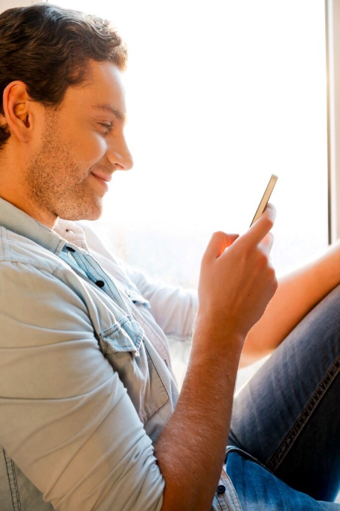5 Ways To Personalize The Car-Buying Journey With Sms Marketing 5 Man Reading Personalized Car-Sales Text Message