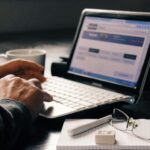 man works on a SMS Marketing Software