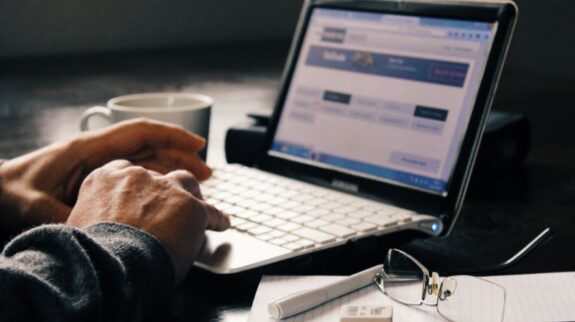 man works on a SMS Marketing Software