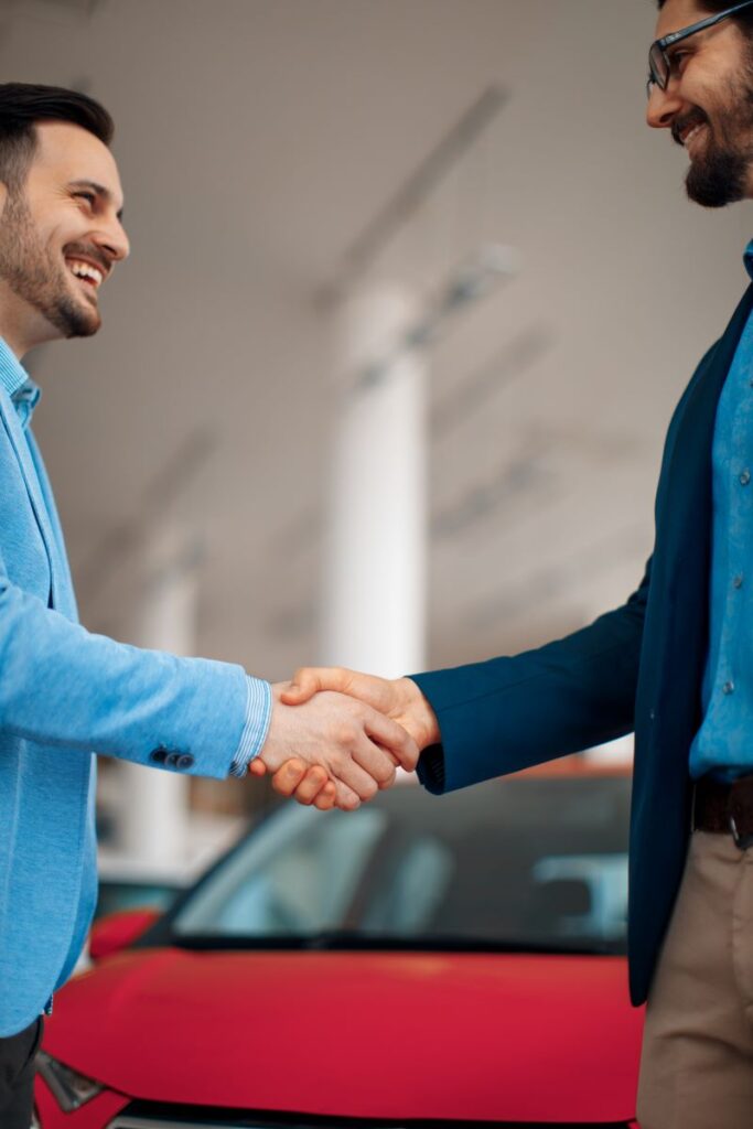 How To Build Lasting Relationships With Automotive Customers Using Tecobi 1 Building Relationships And Shaking Hands After A Successful Car Buying