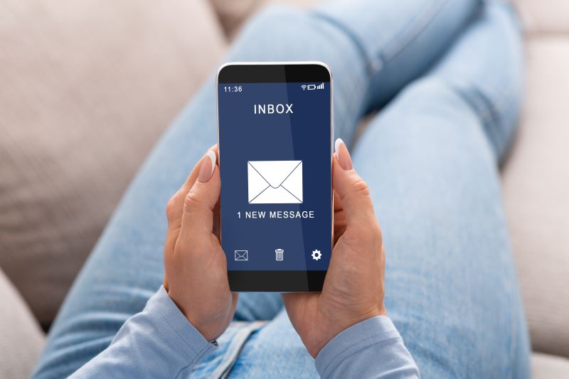 Woman Reading Message On Smartphone
