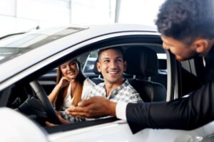young couple choosing a car