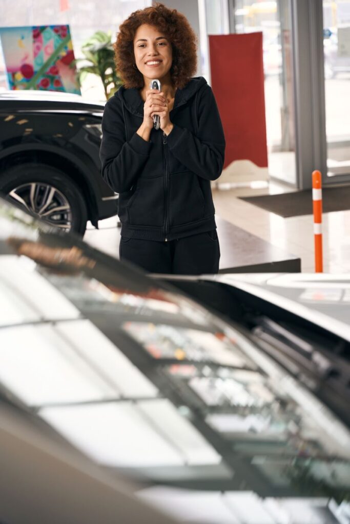 Car Dealership Client Holding The Keys To New Cars