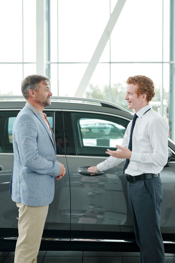 How Automotive Software Is Revolutionizing Car Sales In 2025 1 Confident Sales Manager And His Customer