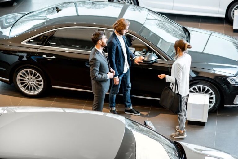 Leads With Salesperson In The Car Showroom