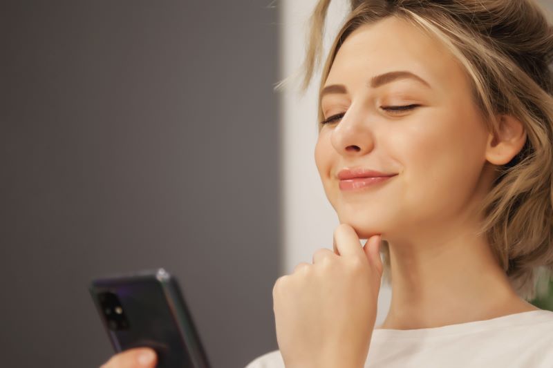 Girl Watching The Ad On Her Phone