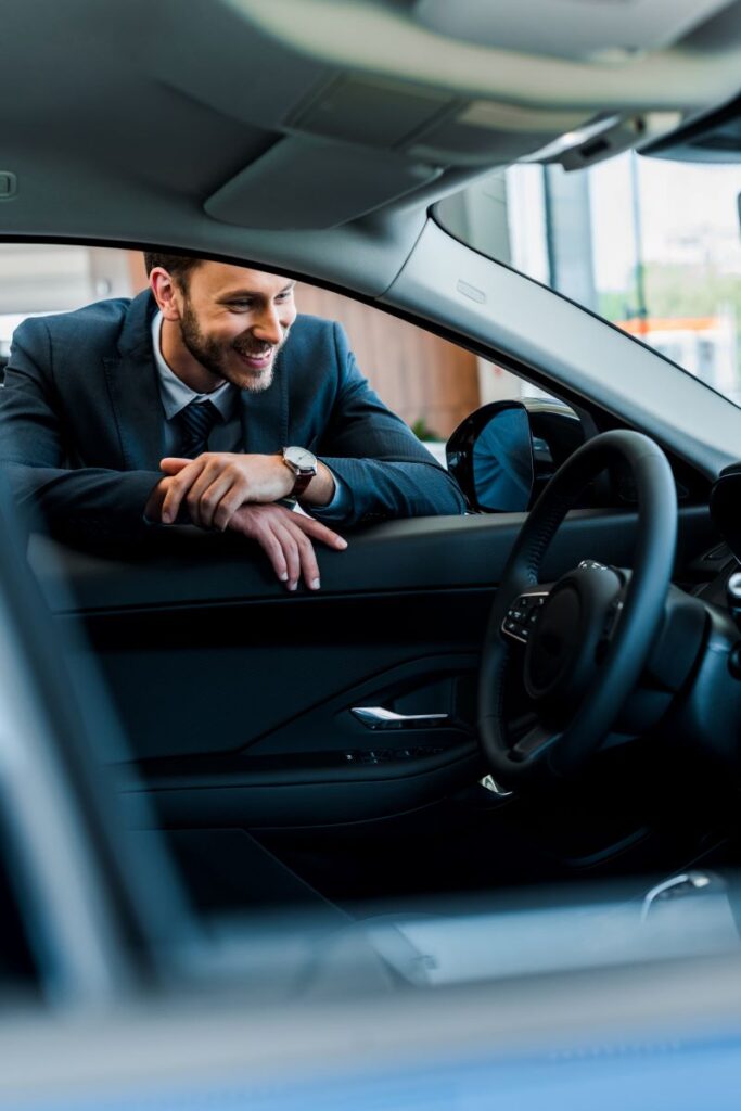 How Automotive Software Is Revolutionizing Car Sales In 2025 2 Happy Man Looking At The New Car