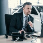 manager at dealership showroom
