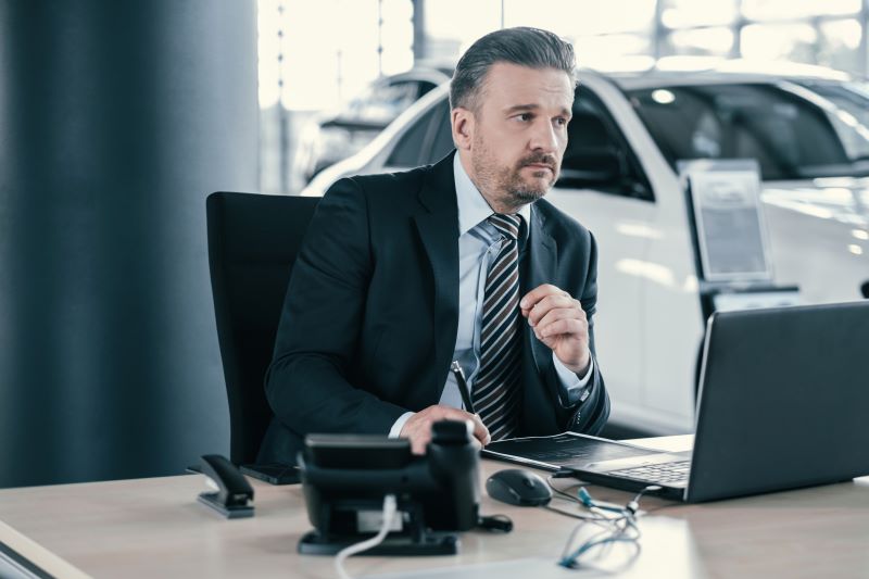 The Future Of Automotive Software: Ai, Automation, And Smarter Sales Tools 3 Manager At Dealership Showroom