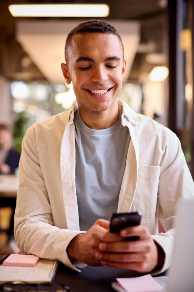 Top Automotive Lead Generation Strategies That Work In 2025 1 Young Man Reading Personalized Sms