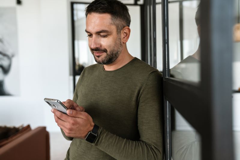 The Power Of Timely Follow-Ups: When And How To Reach Out To Leads 2 Business Man Reading Follow Up Message
