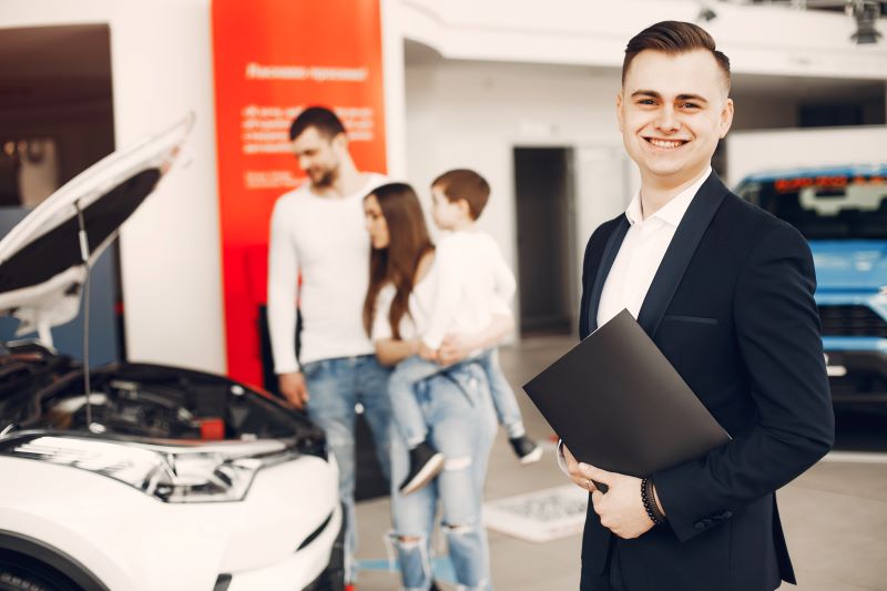 How To Use Facebook And Instagram Ads To Generate High-Quality Auto Leads 1 Family With Little Son In A Car Salon