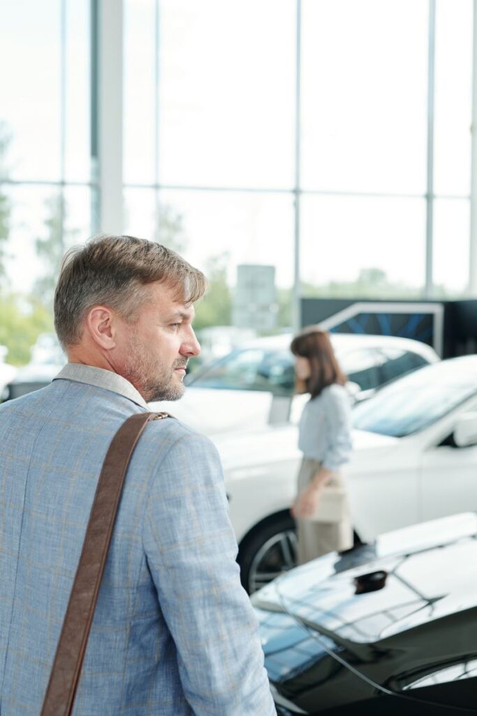 Organic Vs. Paid Automotive Lead Generation: What Works Best? 2 Man Looking At The Cars