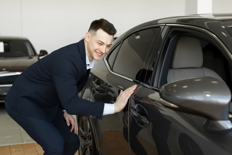 How To Generate High-Quality Leads For Your Dealership—Without Wasting Money 5 Man Touching The Car