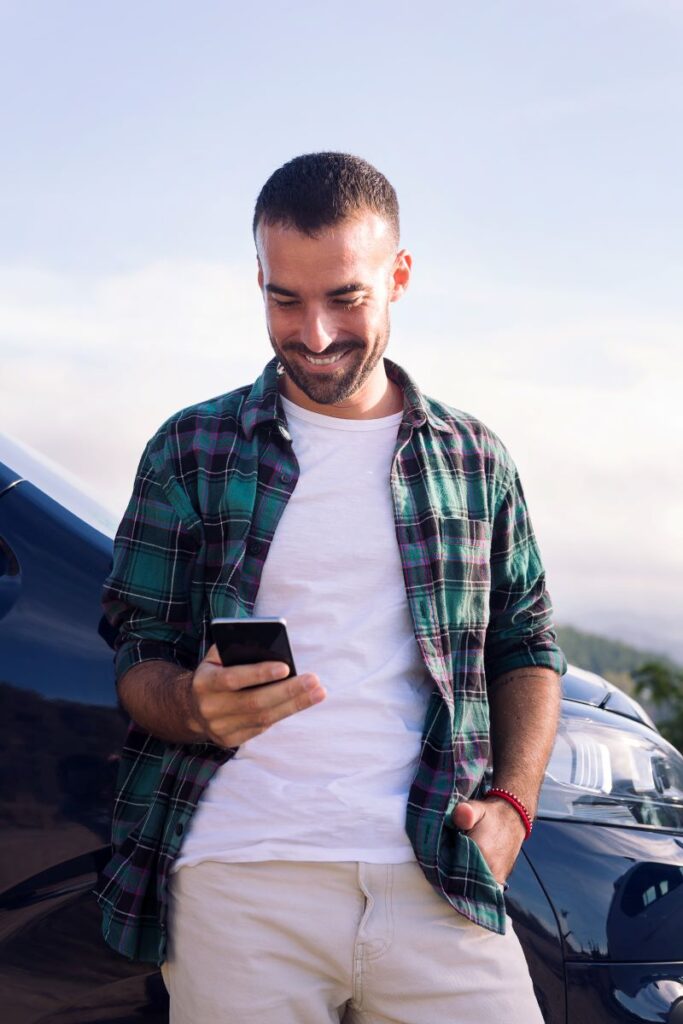 How Dealerships Can Leverage Social Media For Automotive Lead Generation 2 Man Using Mobile Phone