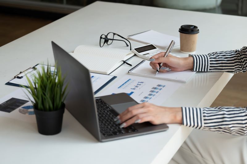 The Future Of Automotive Software: Ai, Automation, And Smarter Sales Tools 4 Women Using Computer And Calculator